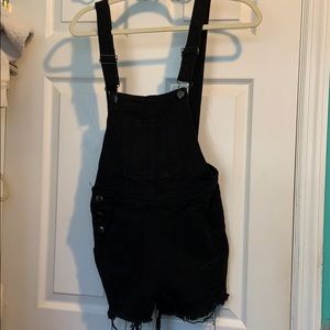 Black ripped denim overalls